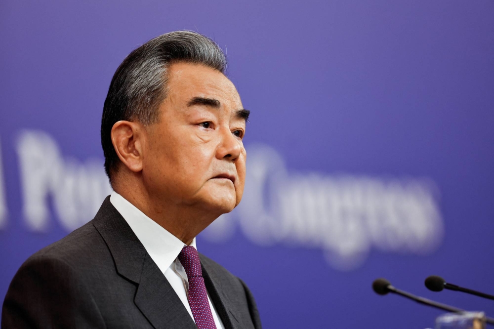 Chinese Foreign Minister Wang Yi attends a press conference on the sidelines of the NPC, in Beijing